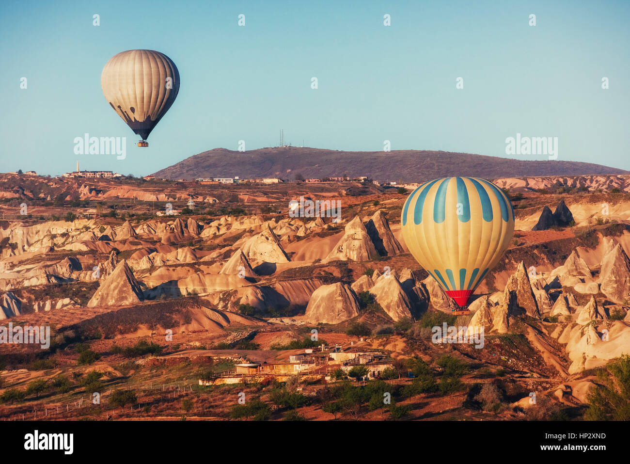 Hot air balloon flying over rock landscape at Cappadocia Turkey Stock ...