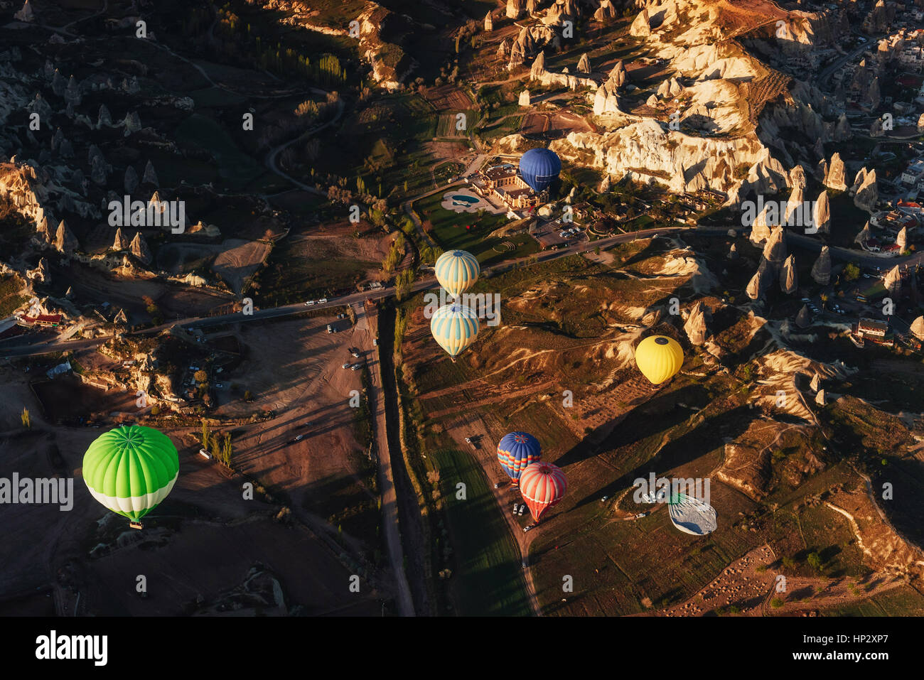 Hot air balloon flying over rock landscape at Cappadocia Turkey Stock ...