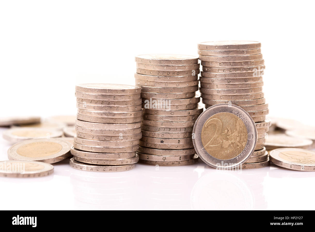 Heap of two euro coins isolated on white background Stock Photo - Alamy