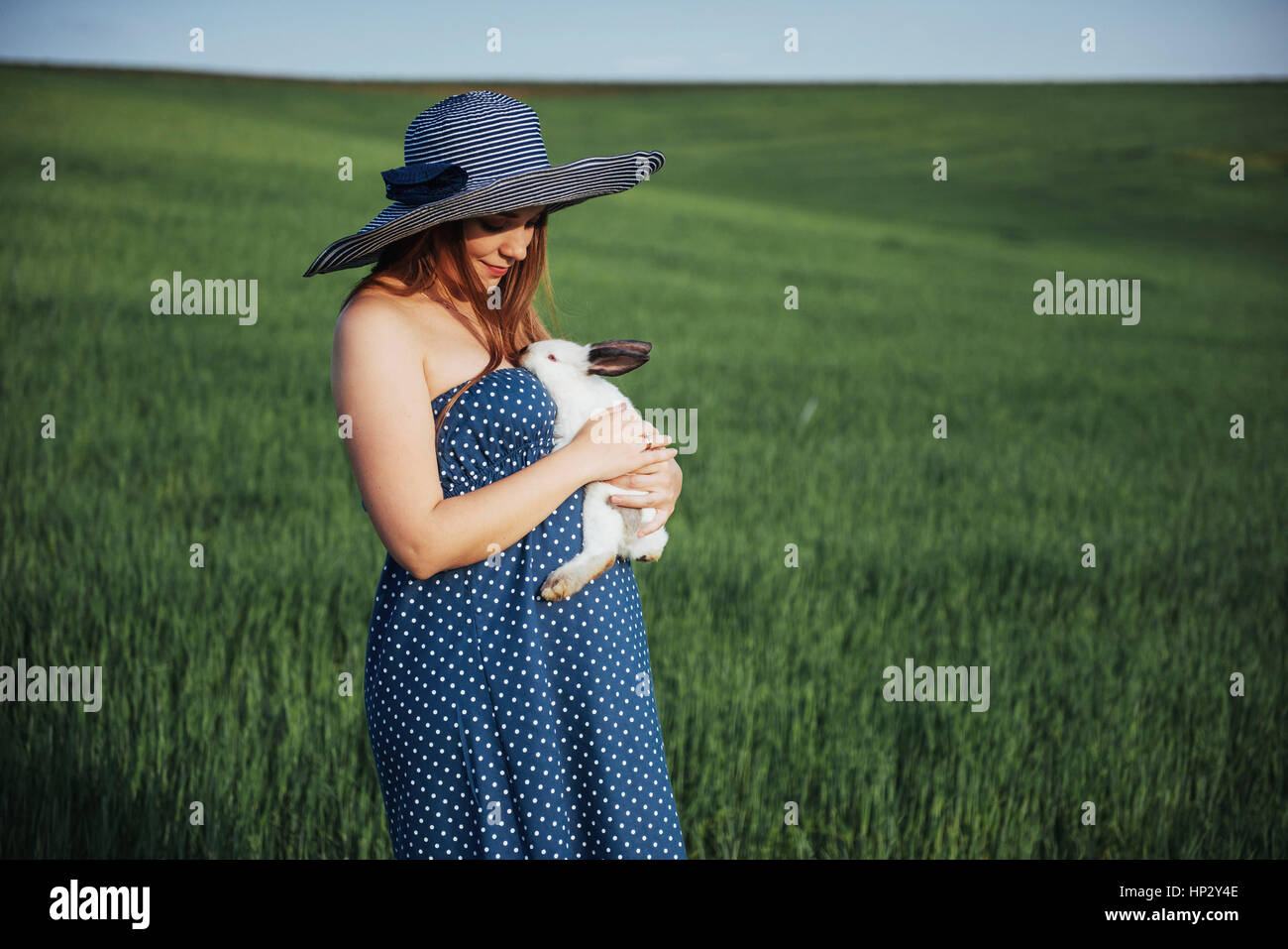 young pregnant woman in a field of wheat Stock Photo - Alamy