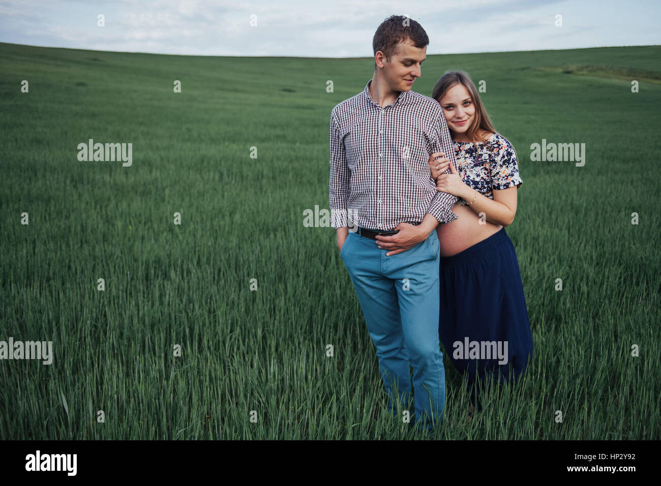Happy couple awaiting baby. Beautiful and young parents Stock Photo - Alamy