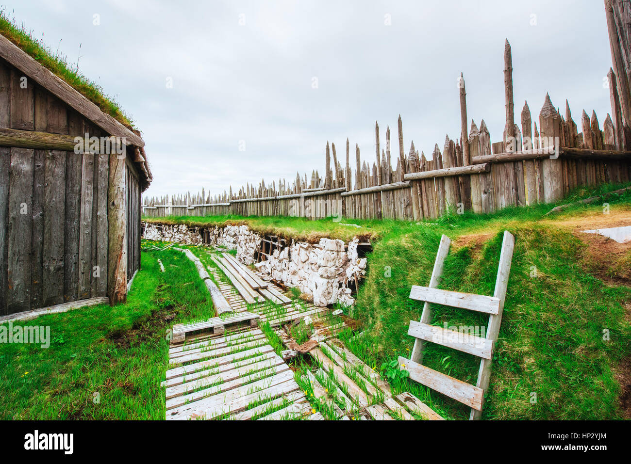 Traditional Viking village. Wooden houses near the mountain firs Stock