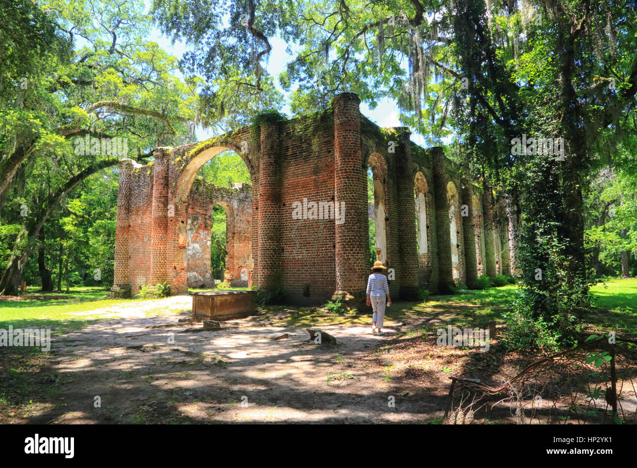 The Sheldon Church ruins at Yemassee, South Carolina are framed by Live Oak trees and Spanish moss in this landscape photo. The ruins are dramatic. Stock Photo