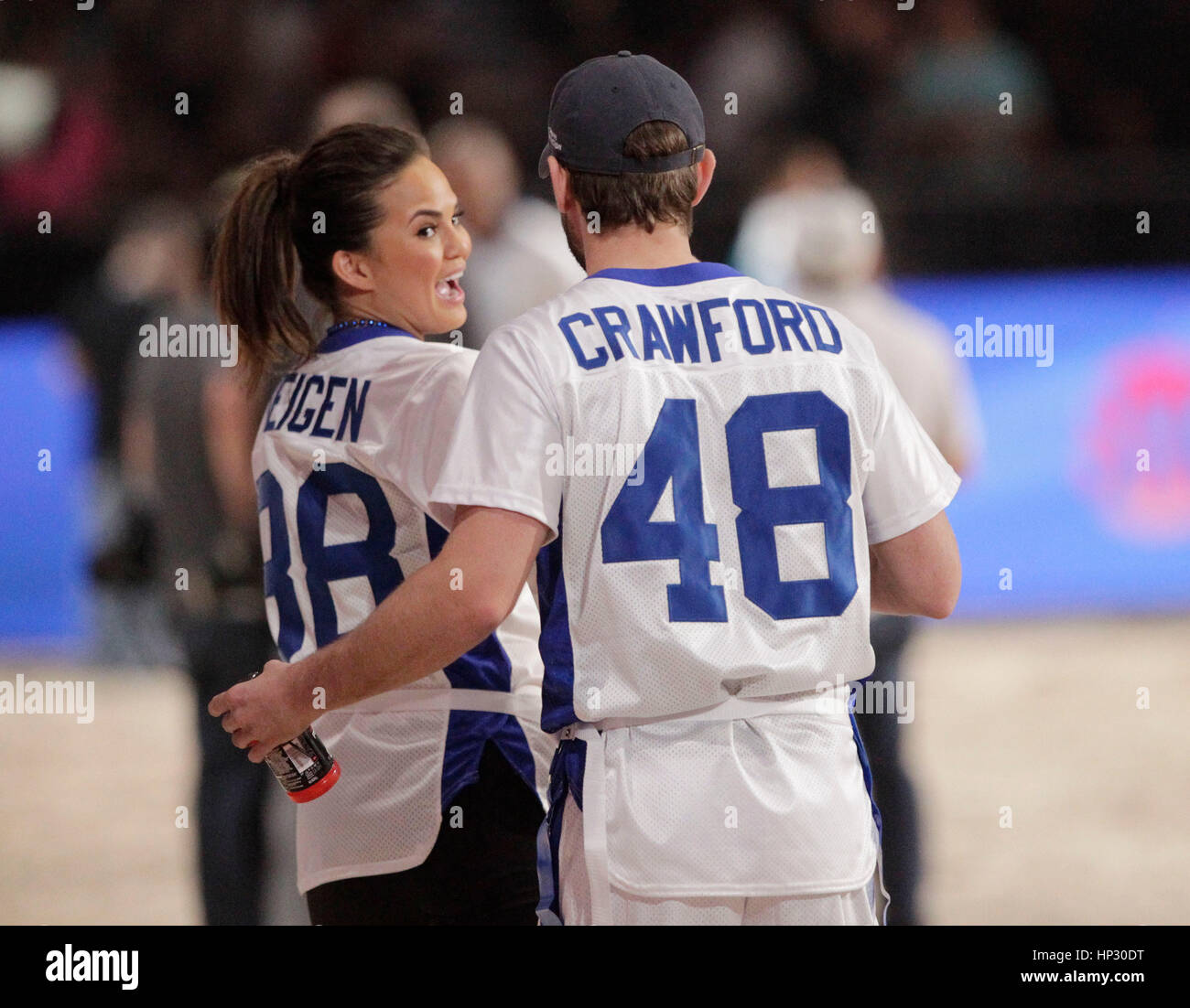 Christine 'Chrissy' Teigen, left, flirts with Chace Crawford at Directv's Seventh Annual Celebrity Beach Bowl on February 2, 2013, in New Orleans, Louisiana. Photo by Francis Specker Stock Photo