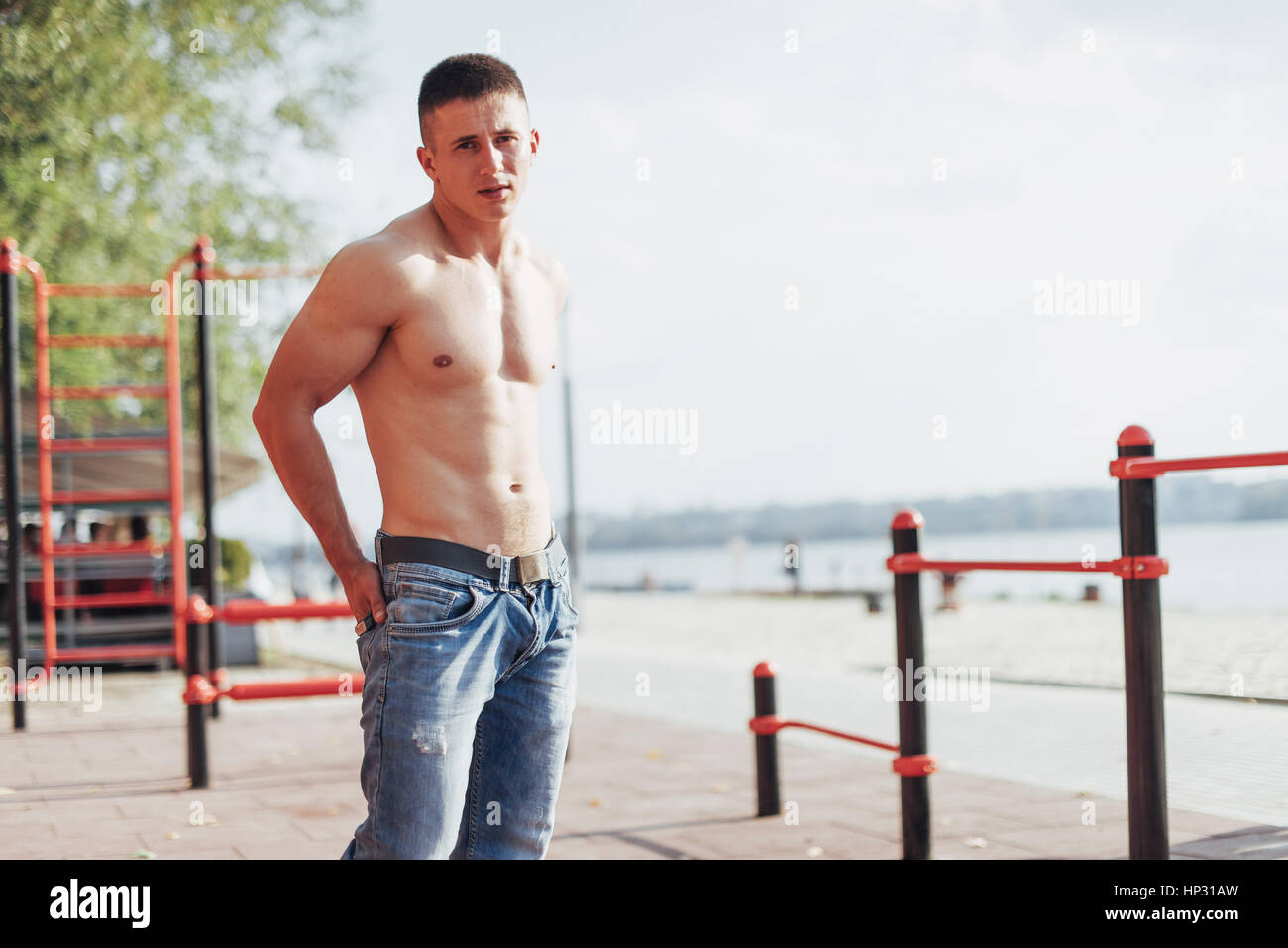 Strong young athlete engaged on the playground Stock Photo