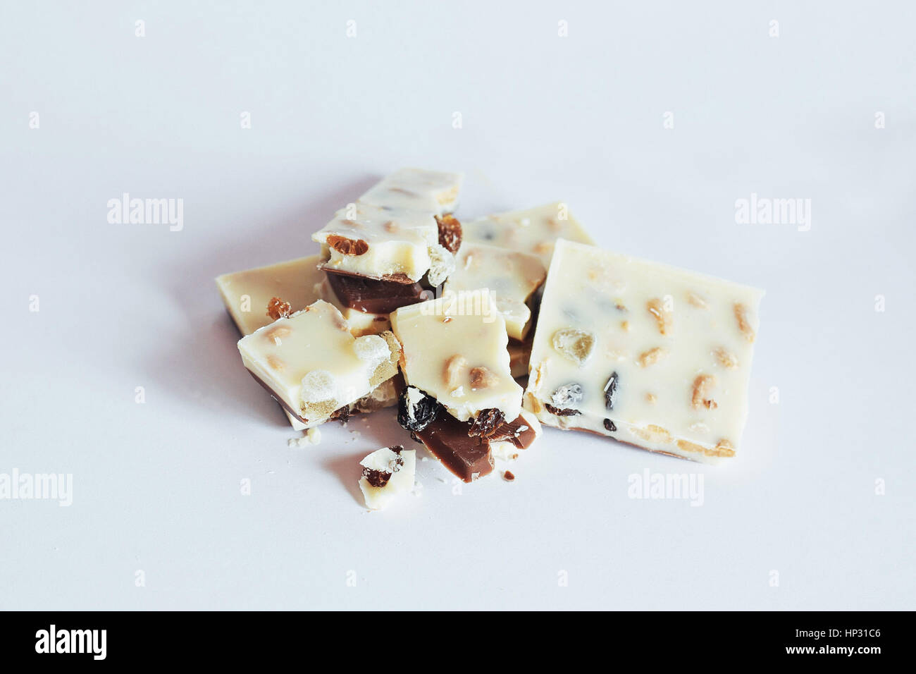 white chocolate with nuts, raisins on a background Stock Photo