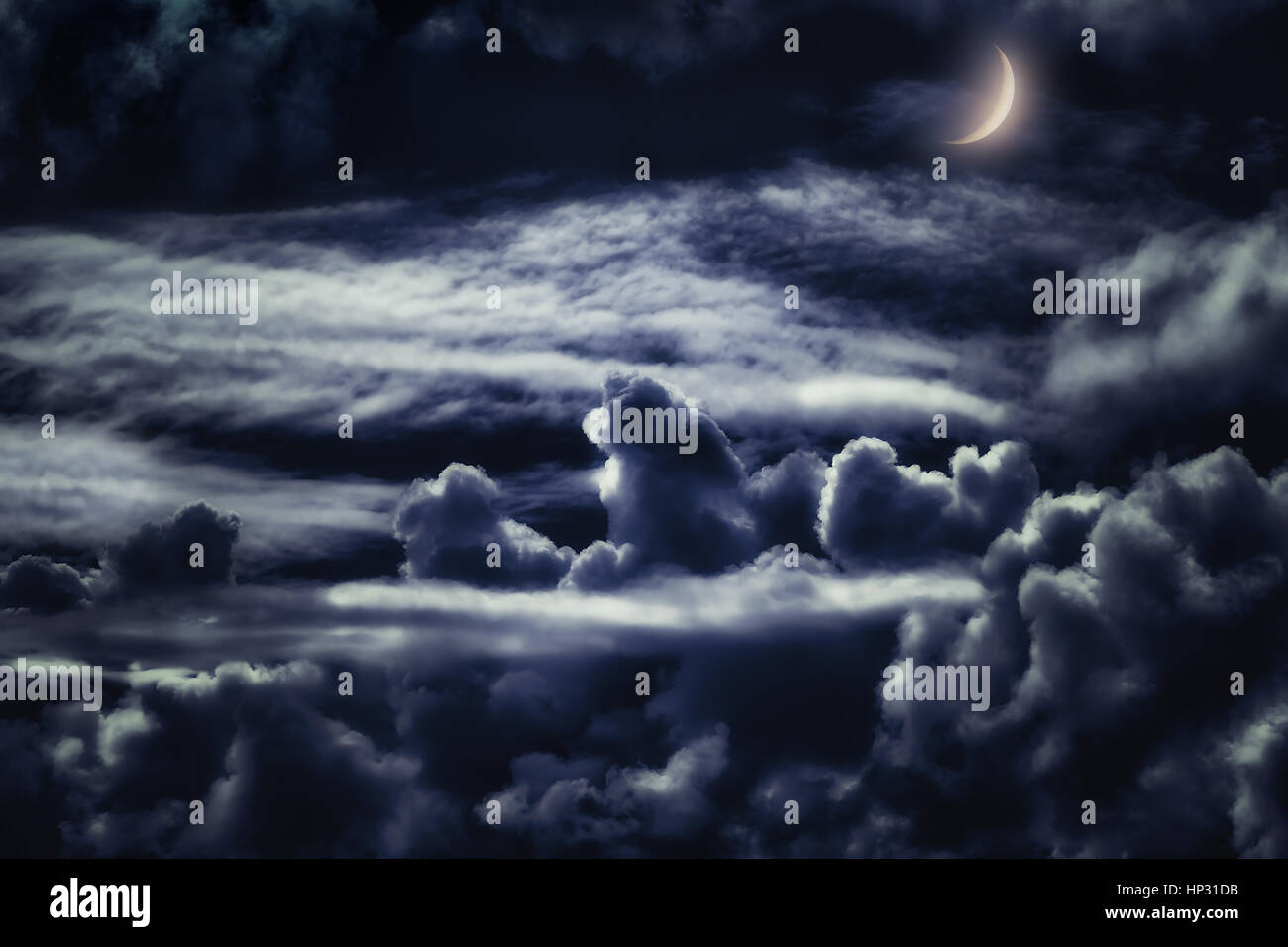 dreamy cloudscape at night with moonlight Stock Photo
