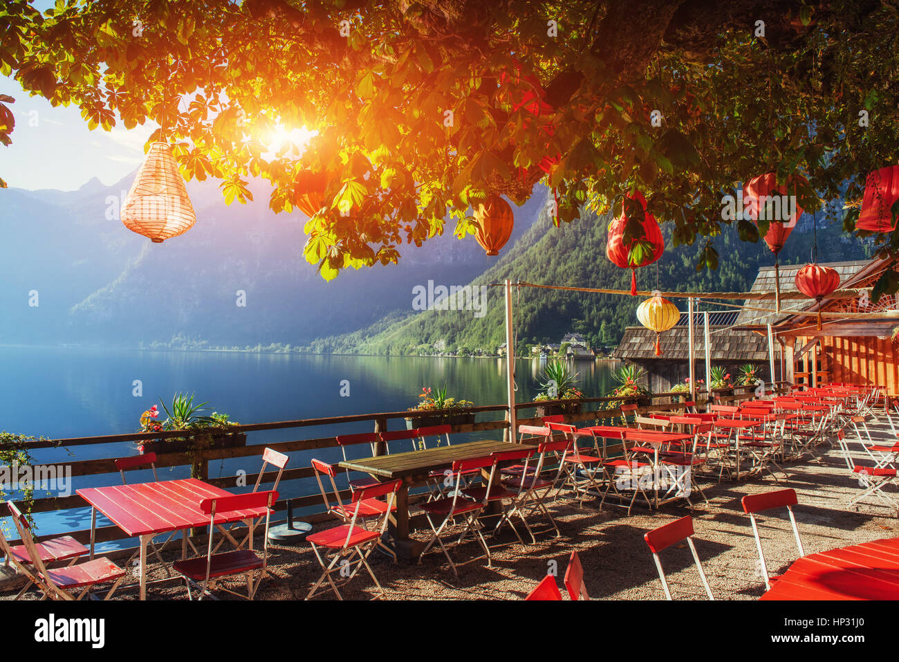 Summer cafe on the beautiful lake between mountains. Alps. Halls Stock Photo