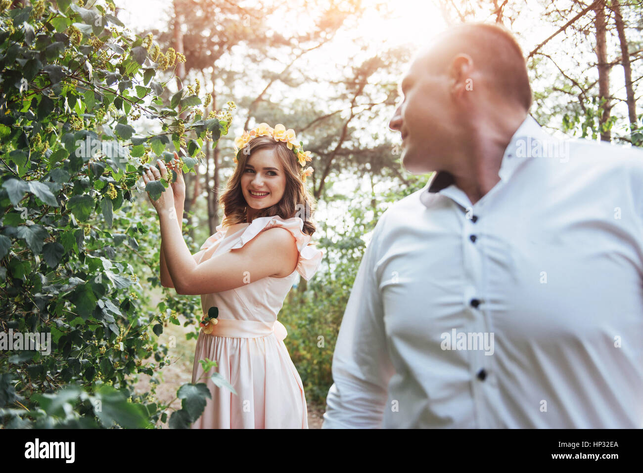 Beautiful happy couple on a walk in the woods Stock Photo - Alamy
