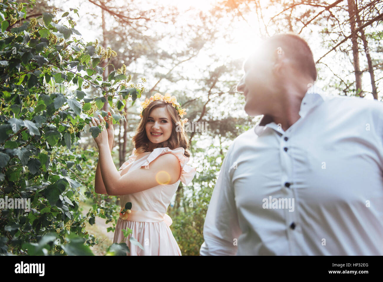Beautiful happy couple on a walk in the woods Stock Photo - Alamy