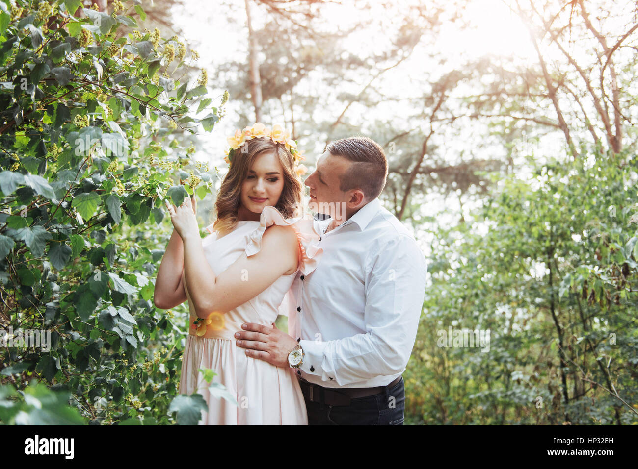 Beautiful happy couple on a walk in the woods Stock Photo - Alamy