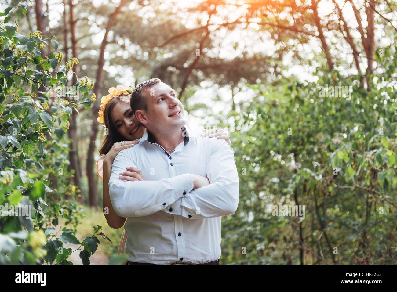 Beautiful happy couple on a walk in the woods Stock Photo - Alamy
