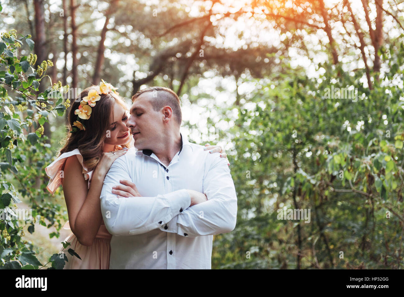 Beautiful happy couple on a walk in the woods Stock Photo - Alamy