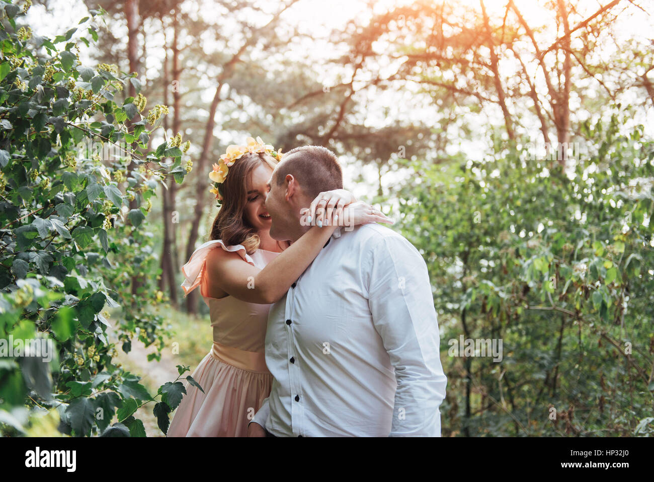 Beautiful happy couple on a walk in the woods Stock Photo - Alamy