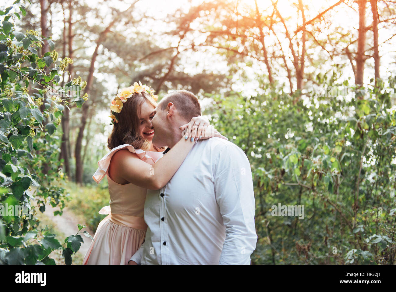 Beautiful happy couple on a walk in the woods Stock Photo - Alamy