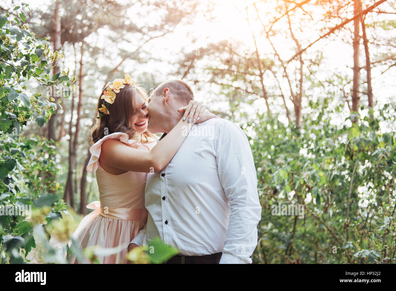 Beautiful happy couple on a walk in the woods Stock Photo - Alamy