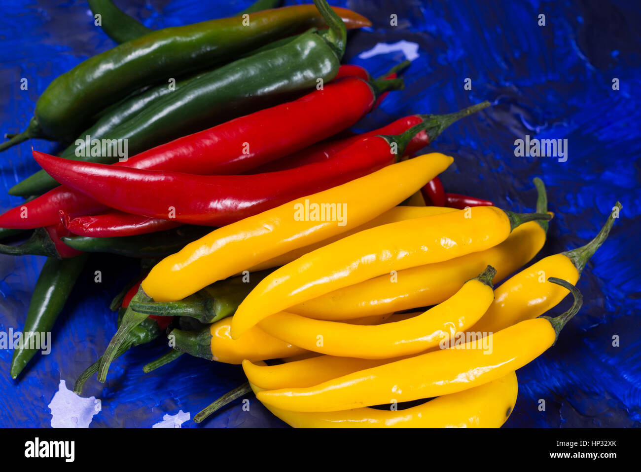 Red, green and yellow mexican hot chili peppers top view Stock Photo ...