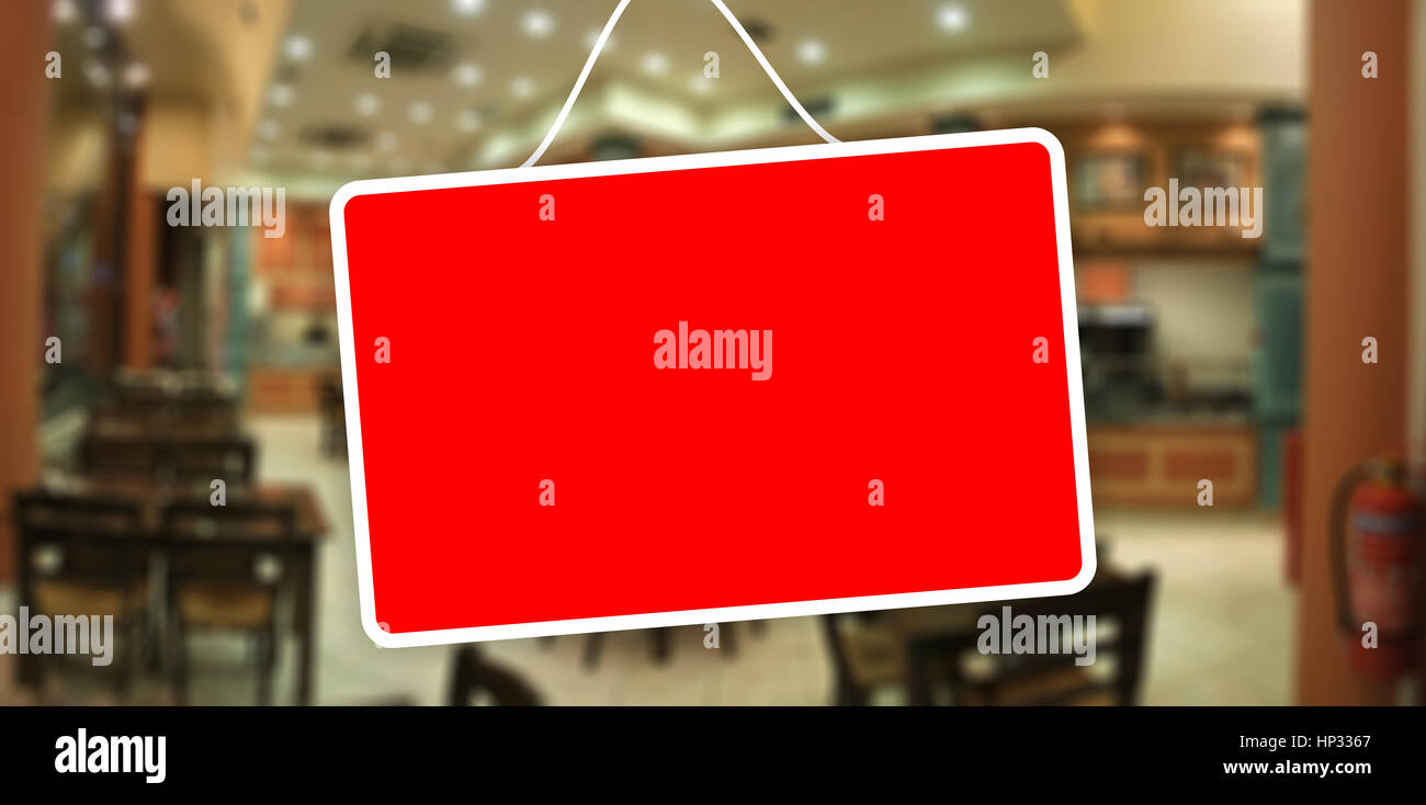 Red sign hanging on a glass storefront Stock Photo Alamy