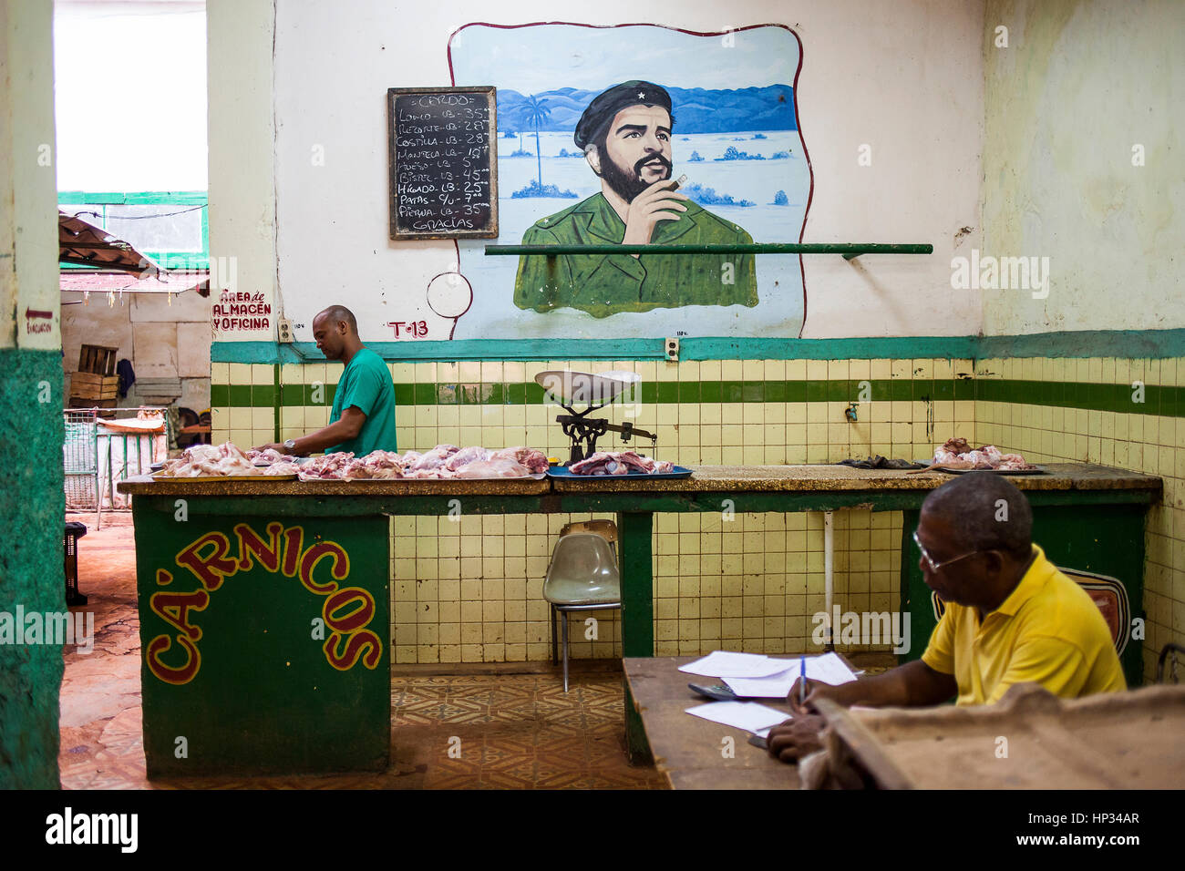 Butcher shop, seller and man accounting, in Old Havana, Habana Vieja, La Habana, Cuba Stock Photo