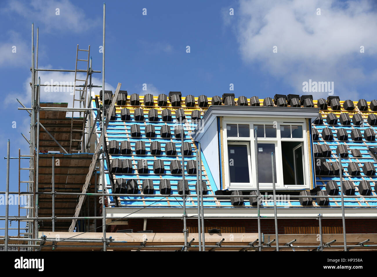 roofing work at new build single-family house Stock Photo