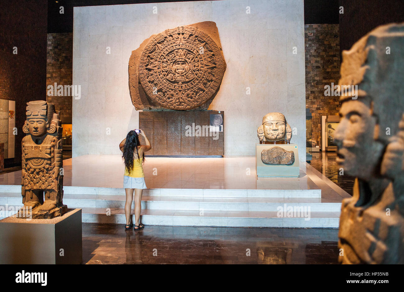 The Aztec Stone of the Sun and other artifacts on display at National Museum of Anthropology, Mexico City, Mexico Stock Photo