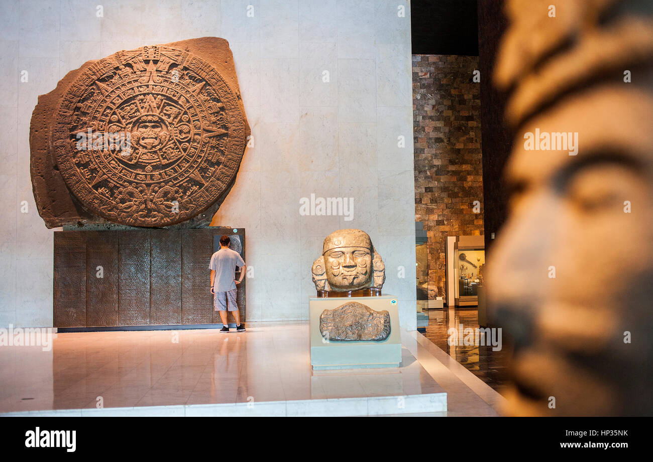 The Aztec Stone of the Sun and other artifacts on display at National Museum of Anthropology, Mexico City, Mexico Stock Photo