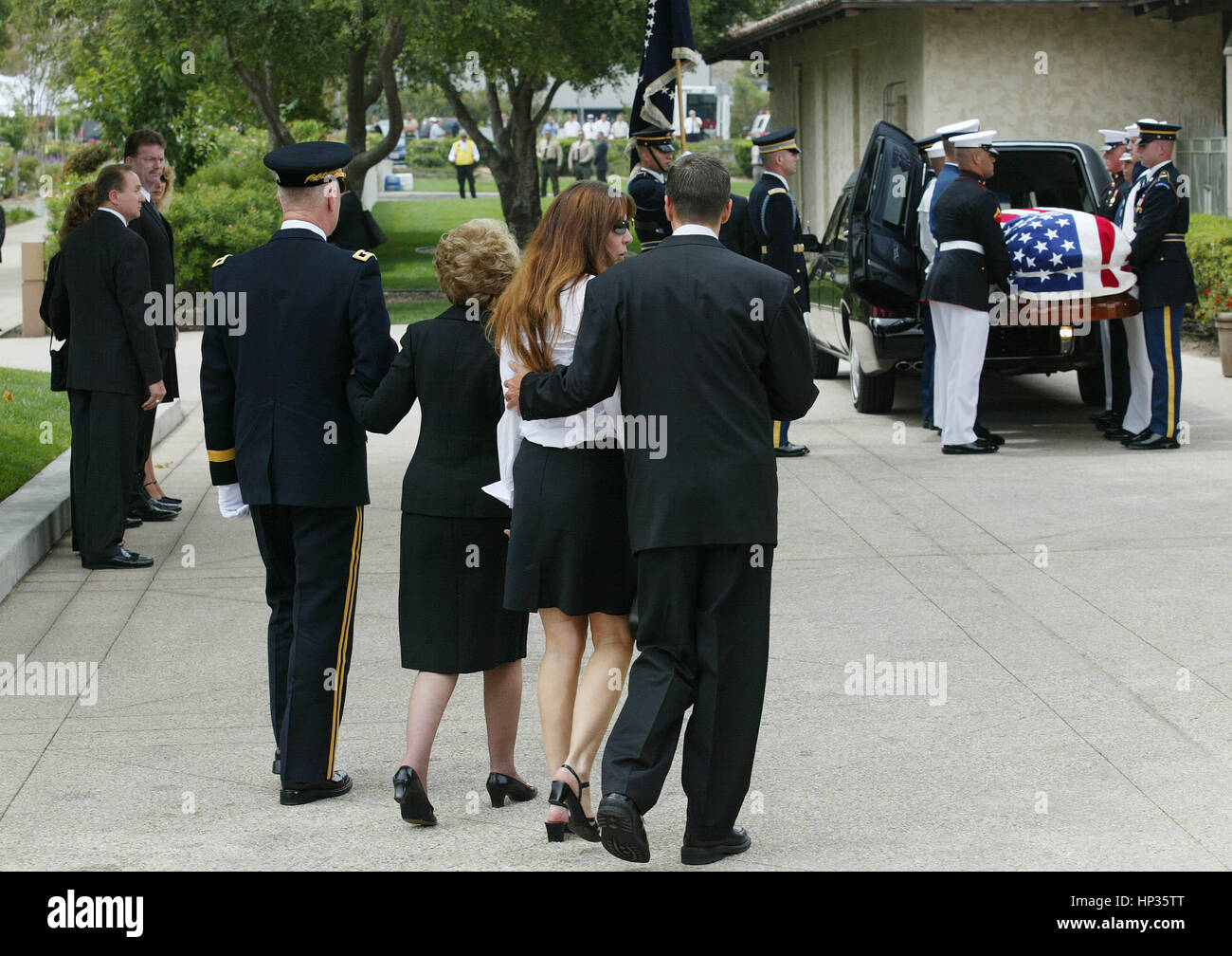 Former First Lady Nancy Reagan is escorted by Major General Galen Jackman along with her children, Patti Davis and Ron Reagan during funeral service at the Reagan Library in Simi Valley, California on June 7, 2004.  Photo credit: Francis Specker Stock Photo