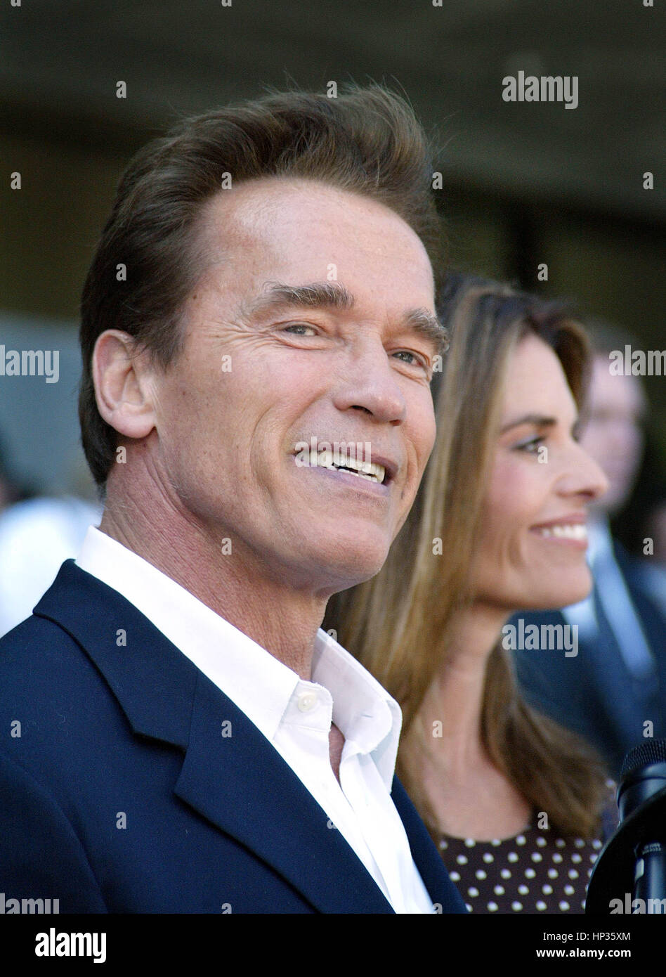 Actor Arnold Schwarzenegger and wife Maria Shriver talk to the media