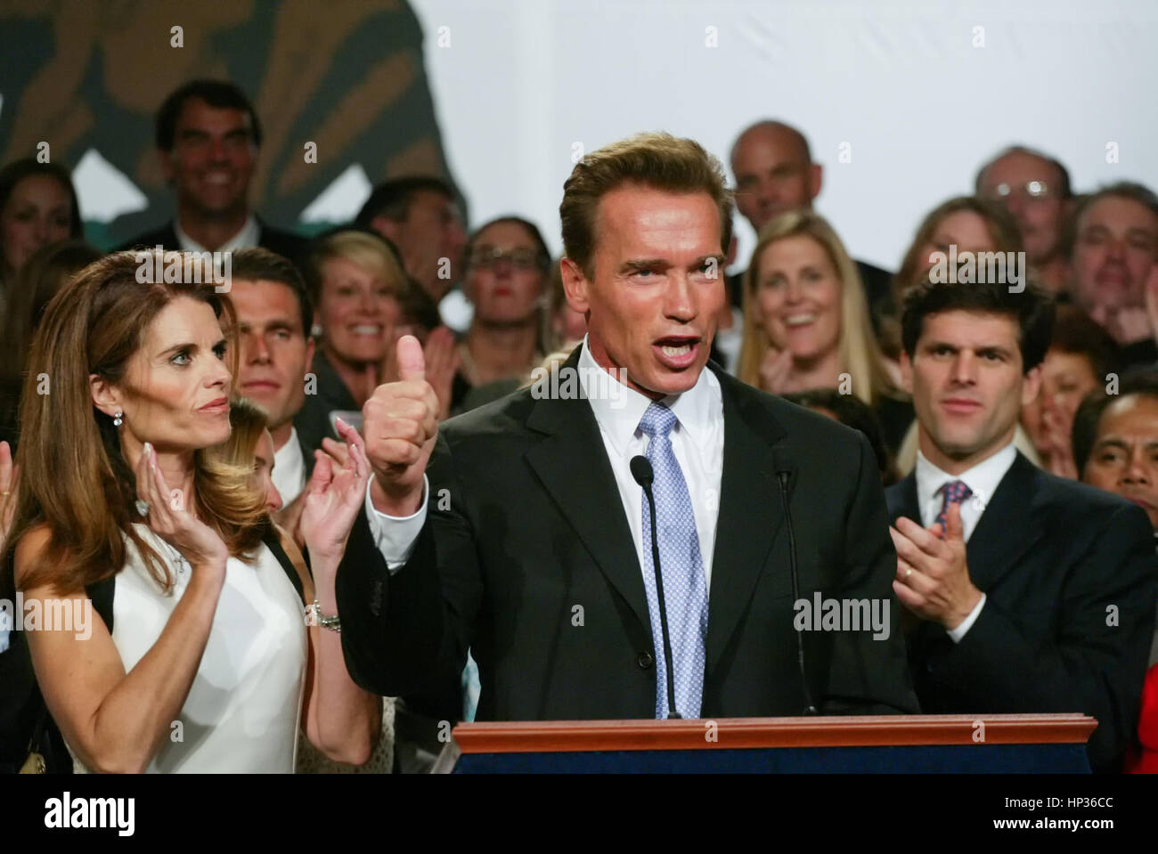 Arnold Schwarzenegger (R) and wife Maria Shriver speak at the podium during his victory party in the gubernatorial recall election in a Los Angeles hotel, 07 October 2003. Actor-turned-politician Arnold Schwarzenegger won handily over his nearest Democratic opponent, Lt. Gov. Cruz Bustamante after Gov. Gray Davis lost by a wide margin in the recall vote.  Mandatory Credit - Photo by Francis Specker Stock Photo