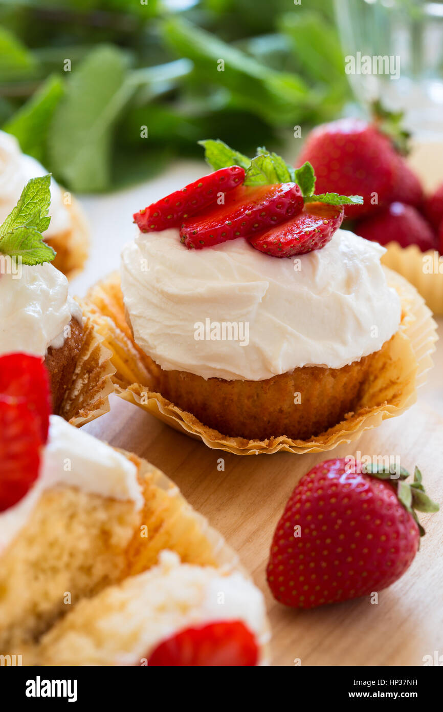 Homemade strawberry cupcakes with whipped cream topping Stock Photo Alamy