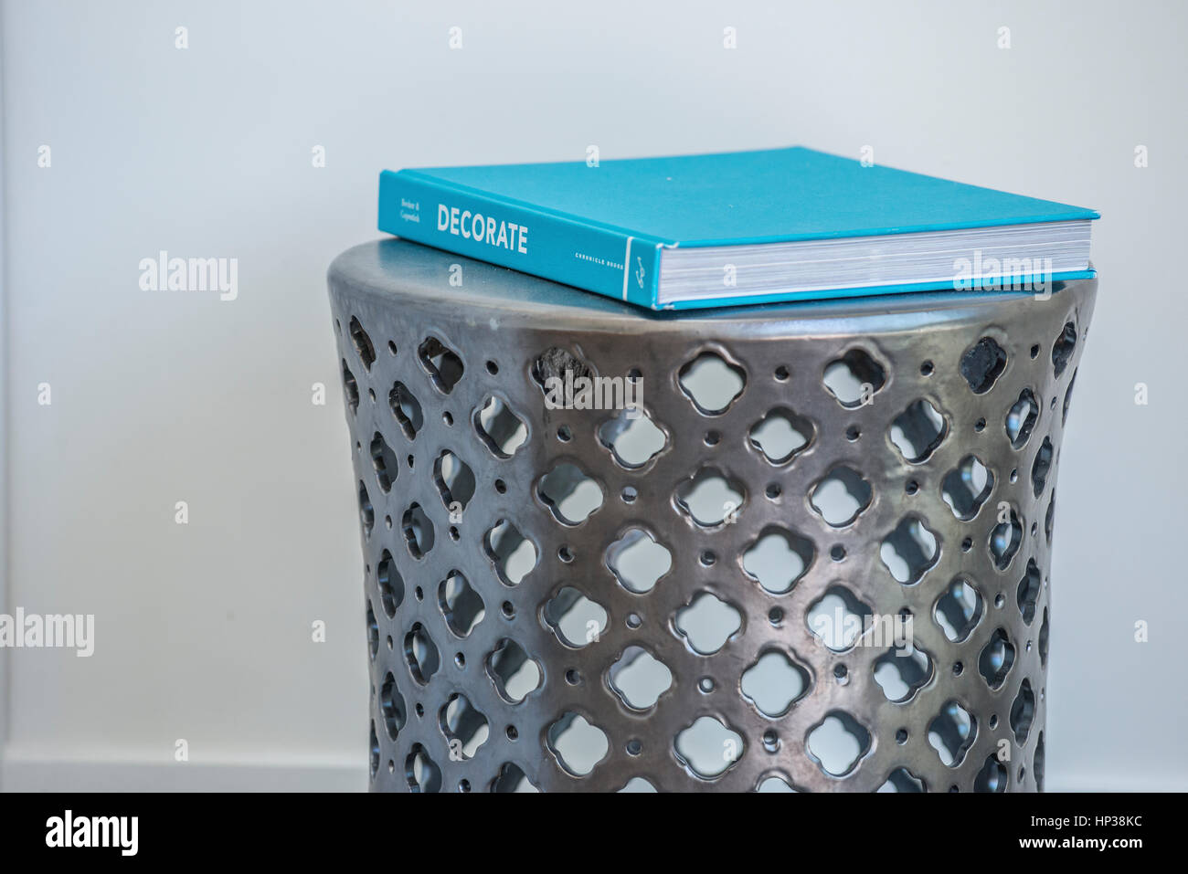Contemporary book stand, Chinese design, lattice metal garden stool Stock Photo