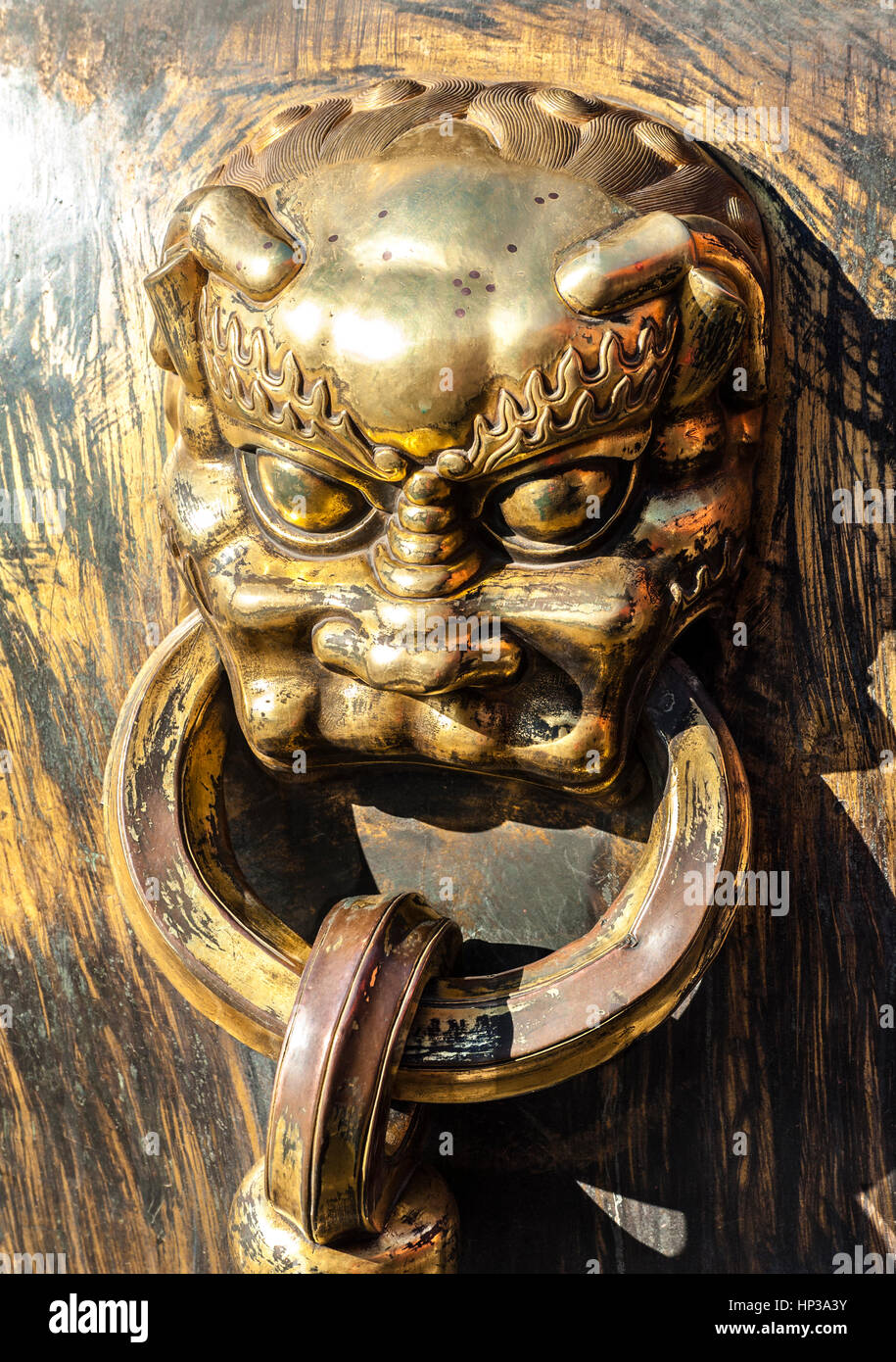 Bronze handle of the water vat in Forbidden City Stock Photo