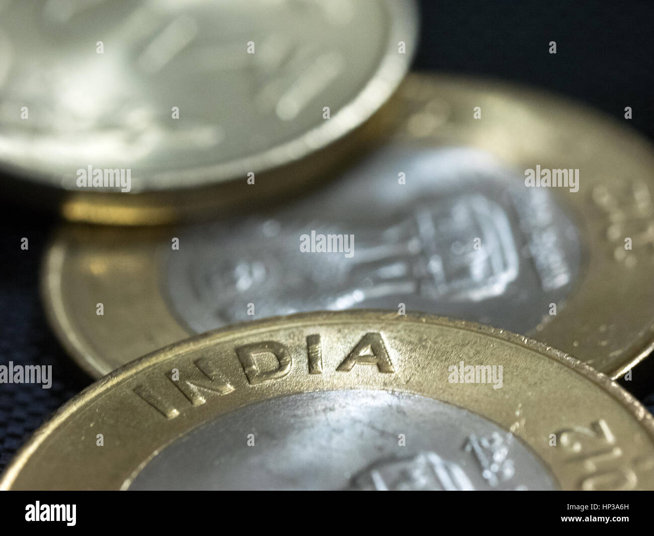 Close-up pictures of Indian currency coins showing details, yellow and white metal Stock Photo