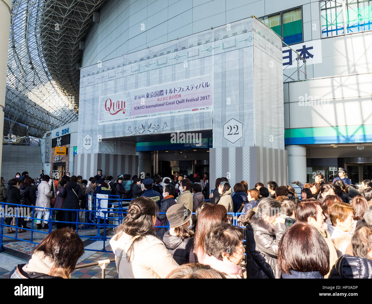 Large queue of people entering the Tokyo International Great Quilt Festival at Tokyo Dome. Stock Photo