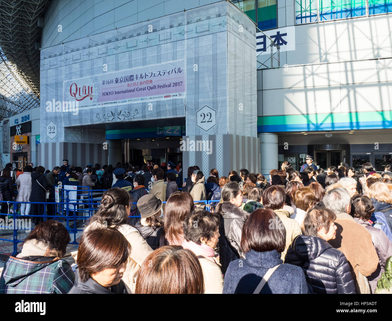 Large queue of people entering the Tokyo International Great Quilt Festival at Tokyo Dome. Stock Photo