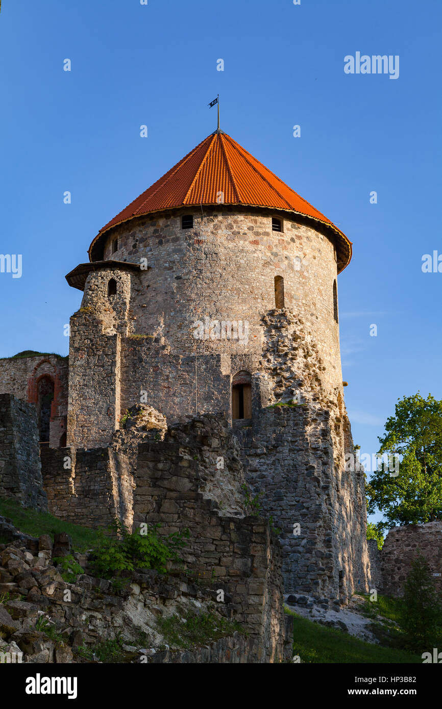 View of beautiful ruins of ancient Livonian castle in old town of Cesis, Latvia. Greenery and summer daytime. Stock Photo