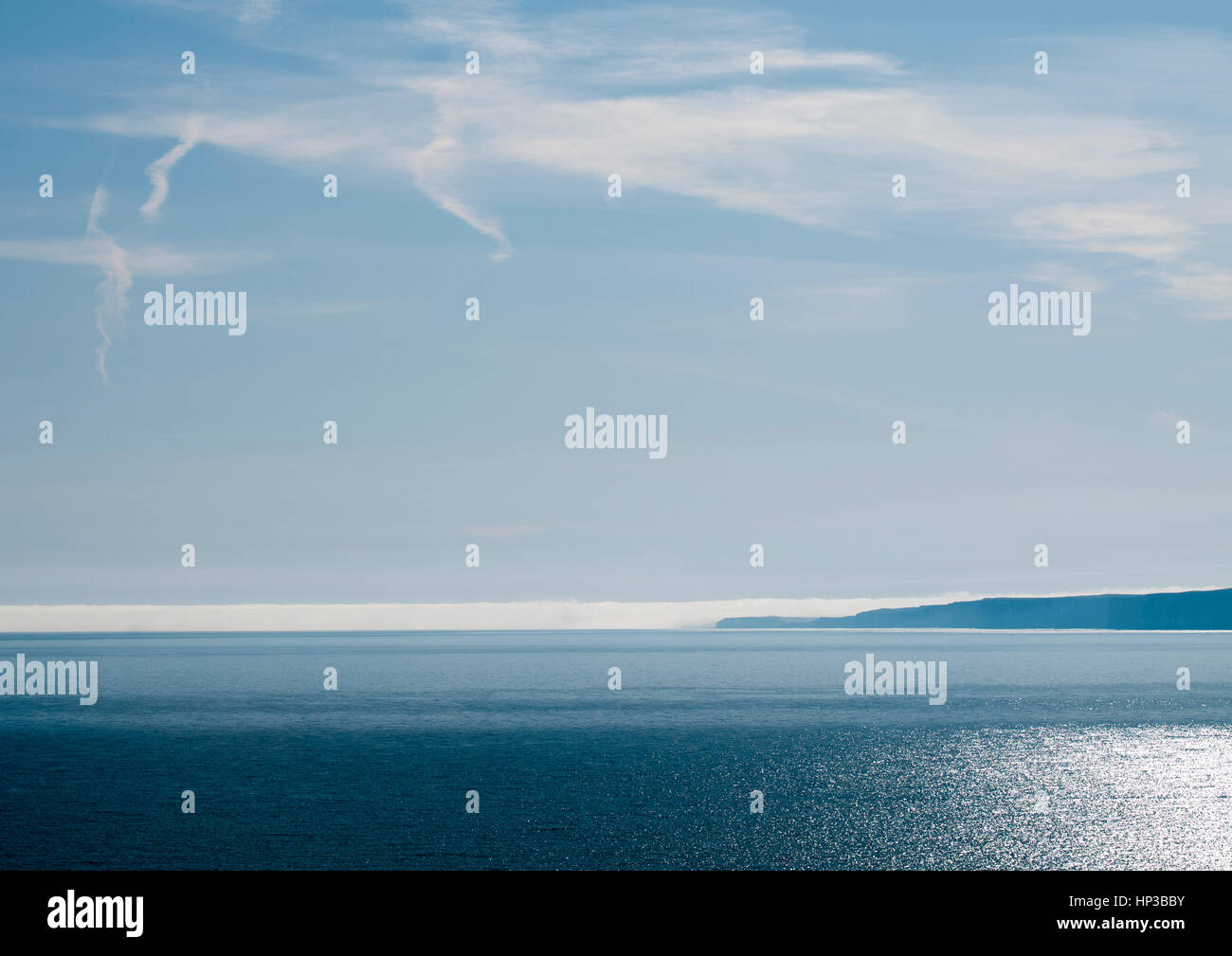 A fog bank on the horizon over the north sea Stock Photo Alamy