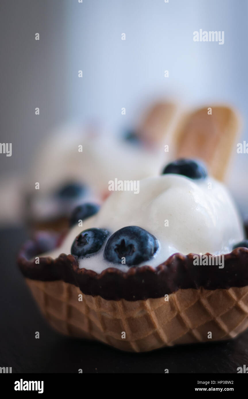 waffle baskets with vanilla ice cream and berries blueberry Stock Photo ...