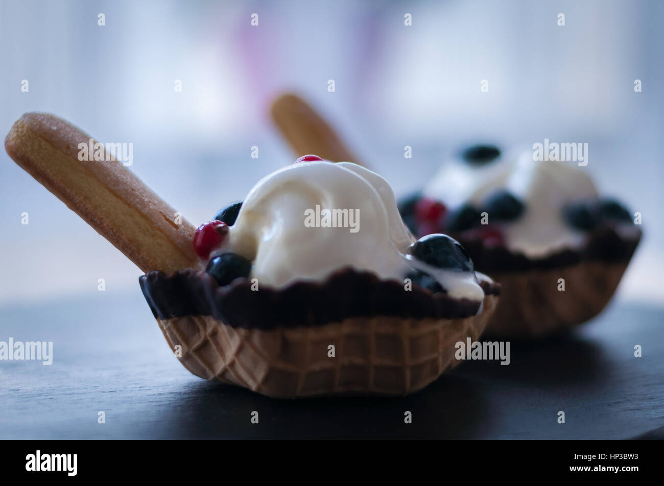 waffle baskets with vanilla ice cream and berries blueberry Stock Photo ...