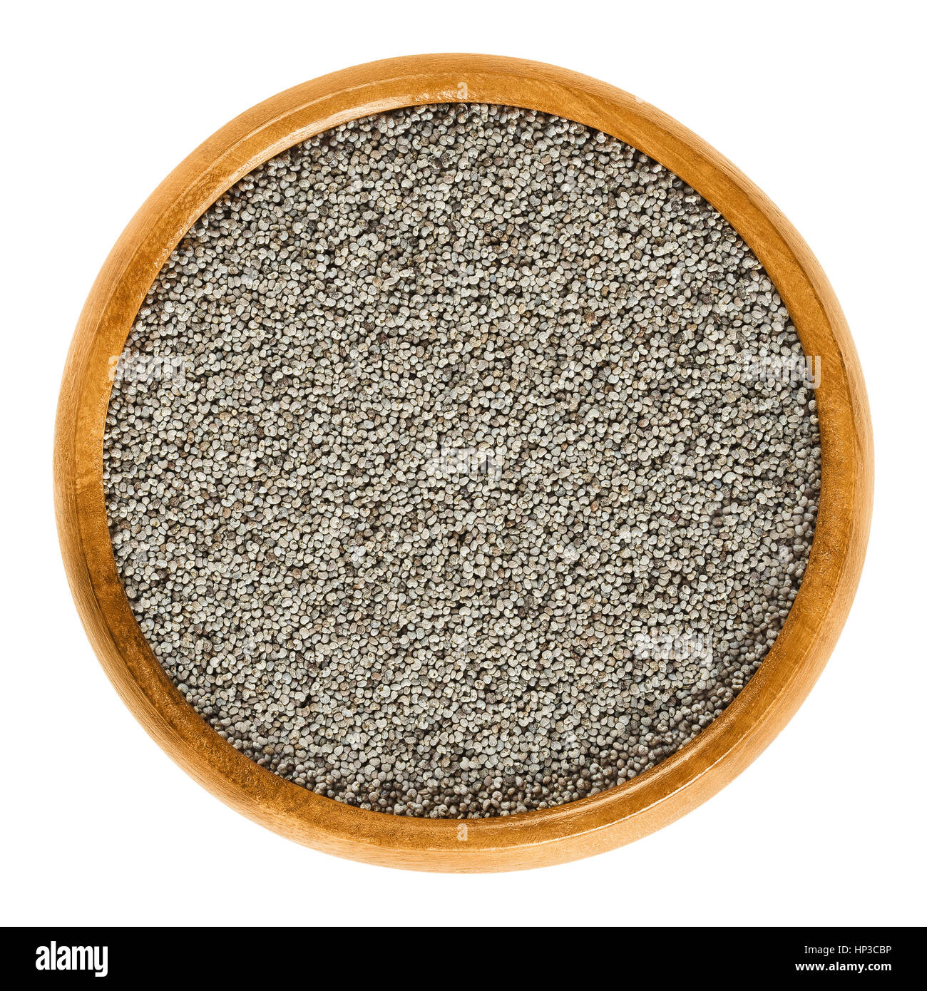 Gray poppy seeds in wooden bowl. Oilseed from opium poppy Paper somniferum with tiny kidney shaped seeds. Stock Photo