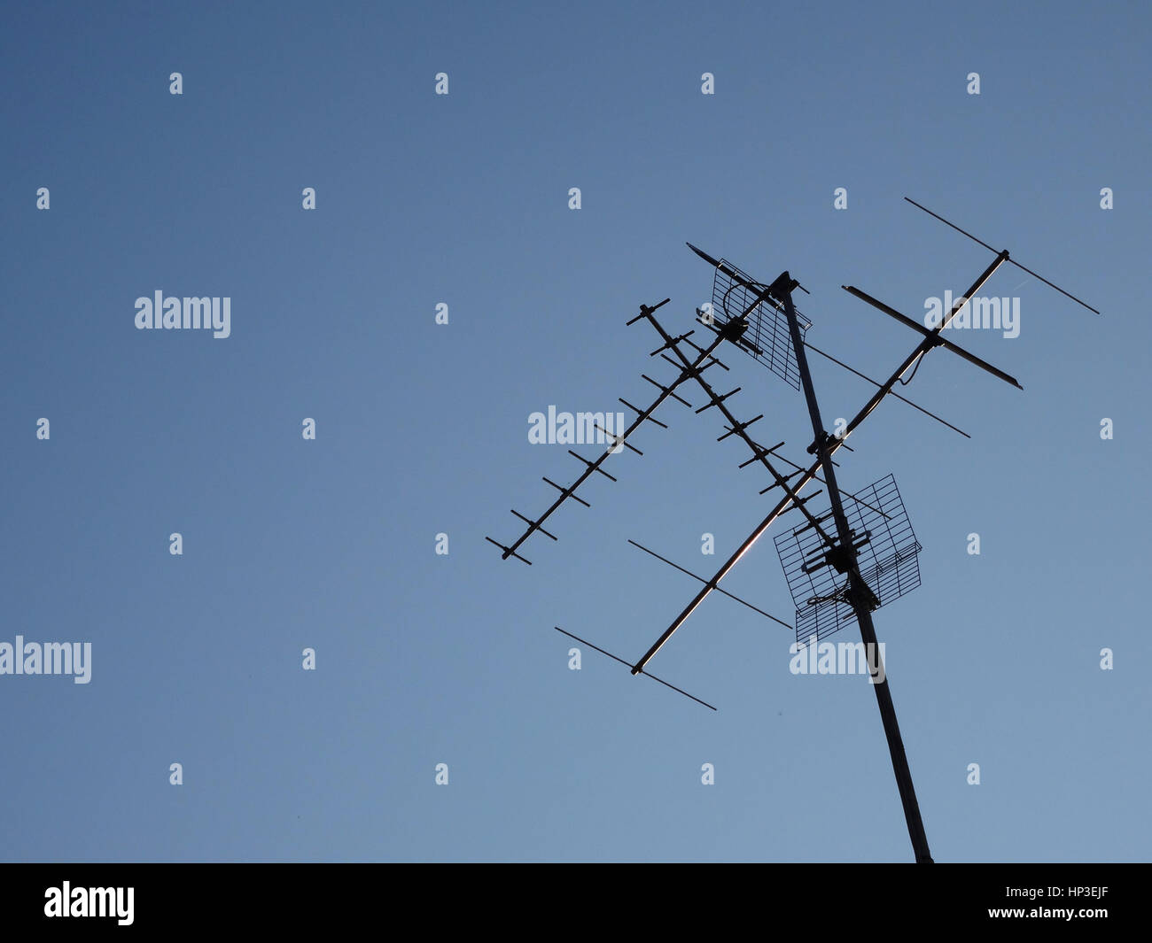 Television receiver antenna against blue sky Stock Photo