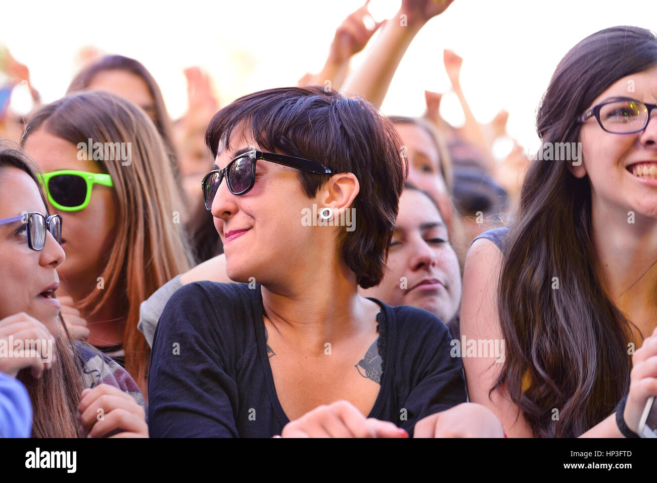 BARCELONA - MAY 23: Girls from the audience in front of the stage, cheering on their idols at the Primavera Pop Festival of Badalona on May 18, 2014 i Stock Photo