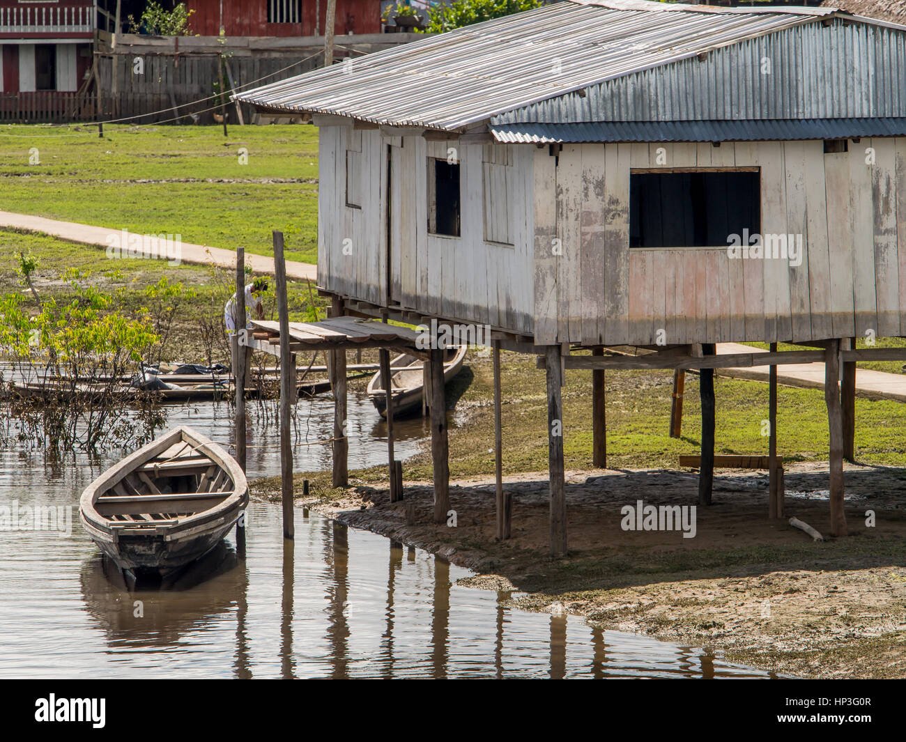 Amazon River, Peru - May 13, 2016: Small village on the bank of the ...
