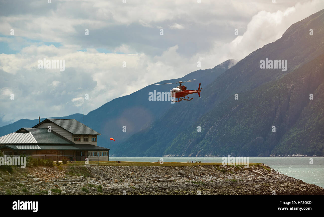 Helicopter tour in Alaska landscape. Tourism helicopter flight in mountains Stock Photo