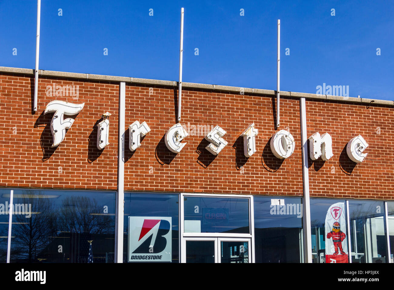 Indianapolis - Circa February 2017: Firestone Complete Auto Care Location with Legacy Neon Sign II Stock Photo