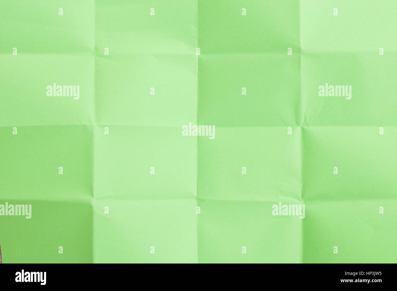Green sheet of paper folded in sixteen parts Stock Photo Alamy