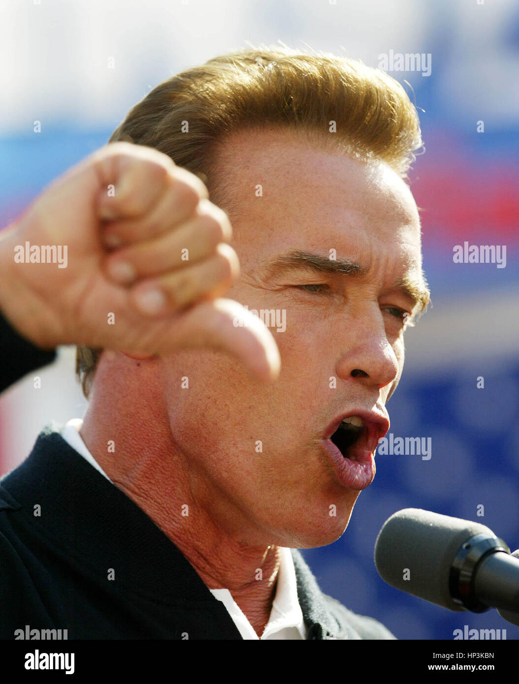 California gubernatorial candidate Arnold Schwarzenegger  puts his thumb down about the current administration during a campaign rally in Modesto, Calif. on Saturday, 4 , October 2003. Schwarzenegger is running in the 7 October recall election. Photo by Francis Specker Stock Photo