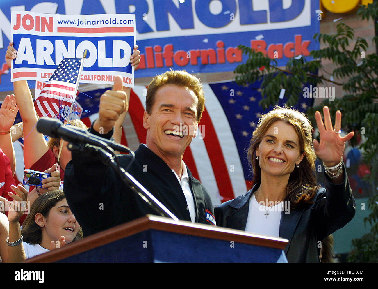 California gubernatorial candidate Arnold Schwarzenegger  and his wife, Maria Shriver, wave to the crowd during a campaign rally Modesto, Calif. on Saturday, 4 , October 2003. Schwarzenegger is running in the 7 October recall election. Photo by Francis Specker Stock Photo