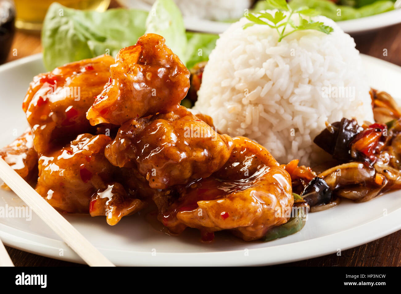 Fried chicken pieces in batter with sweet and sour sauce Stock Photo