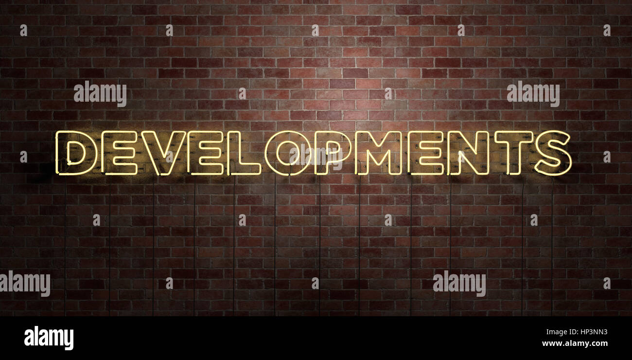 No Developments Sign DEVELOPMENTS - fluorescent Neon tube Sign on brickwork - Front view ...